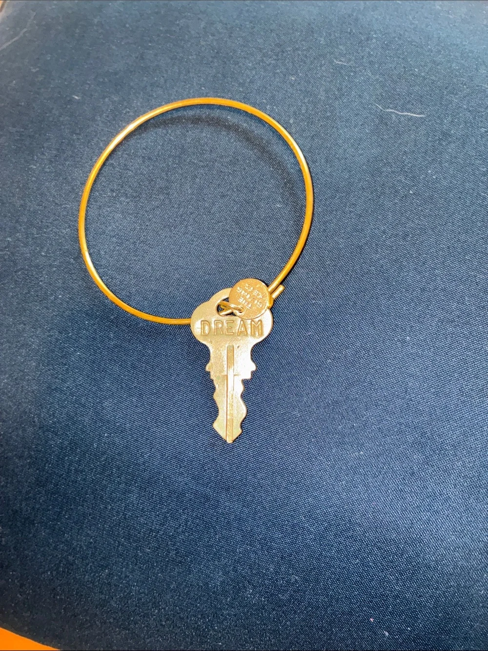 Gold Tone Bangle Bracelet by the “Giving Keys”